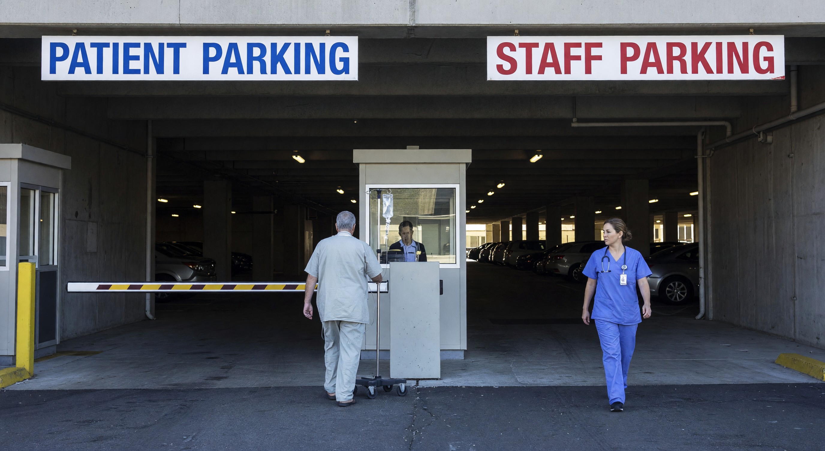 Hospital parking garage entrance with patient and staff parking signage